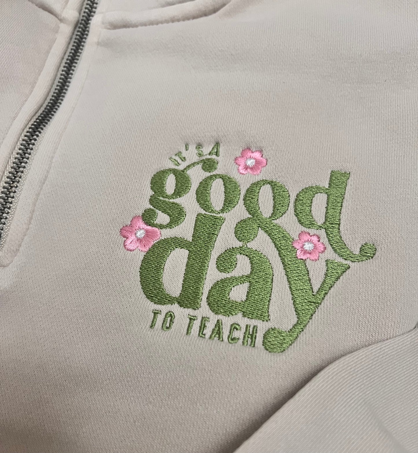 Embroidered text on a beige hoodie with pink flowers
its a good day to teach 
teacher appreciation gift 
